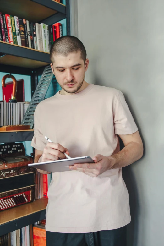 a man looking down at a clip board