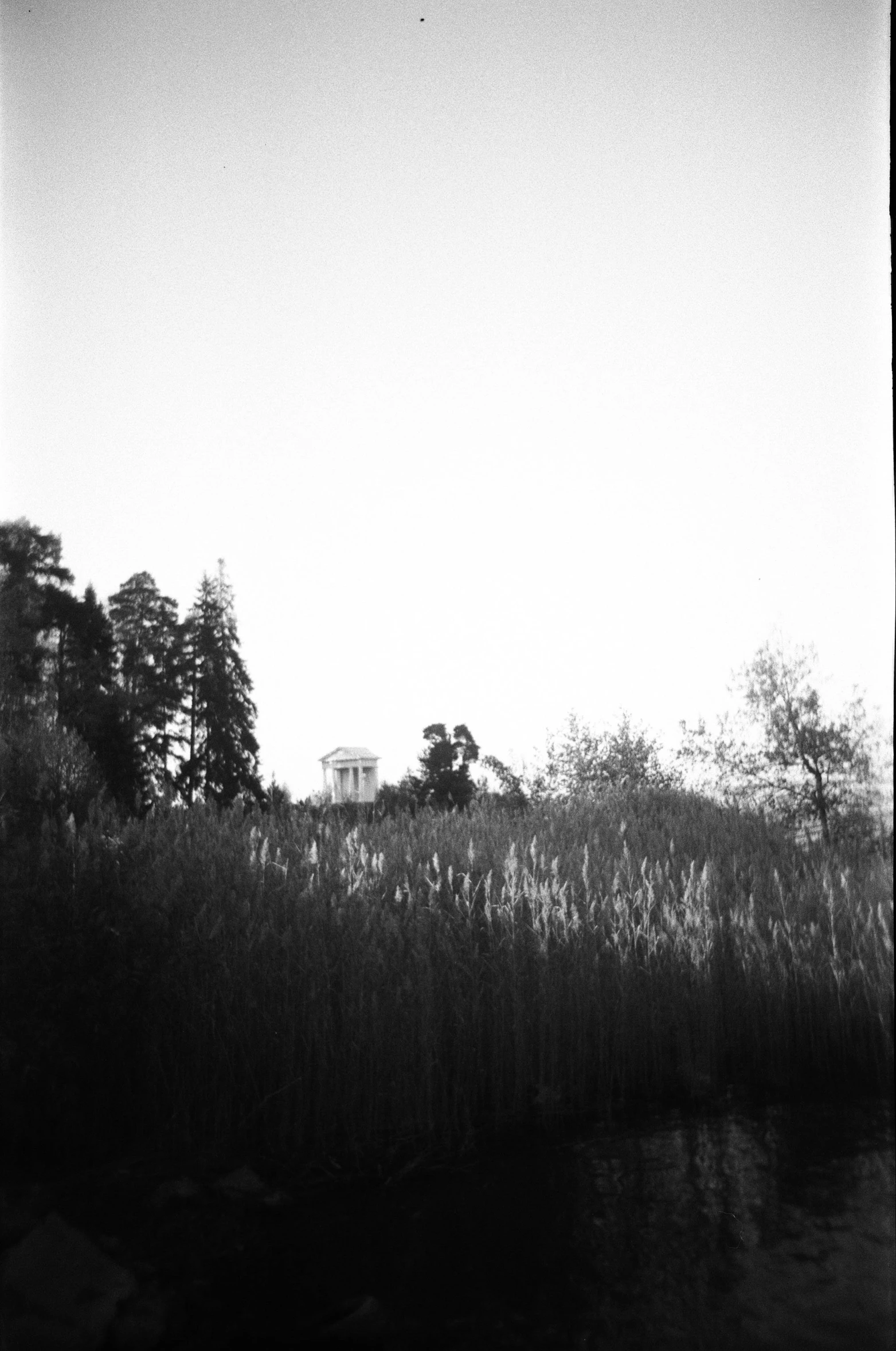 a house is shown sitting over a body of water