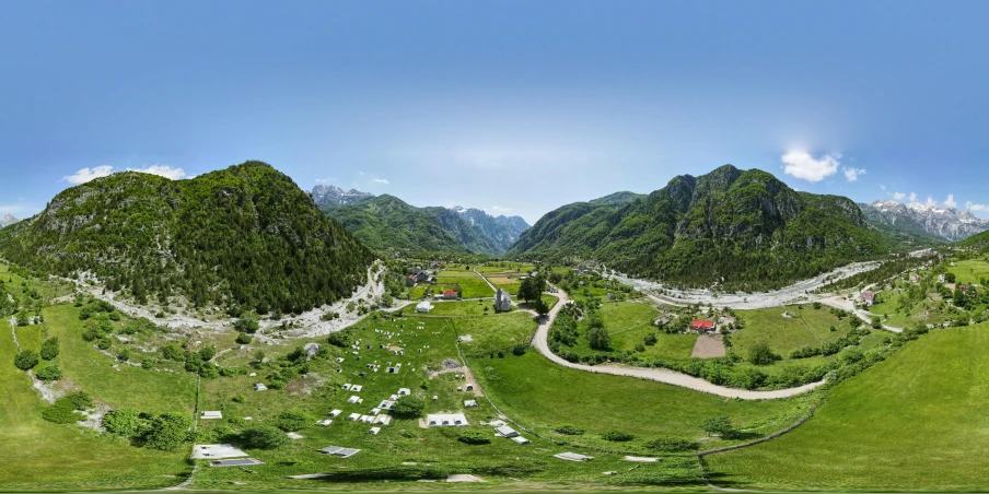 several sheep grazing and grazing in a green valley