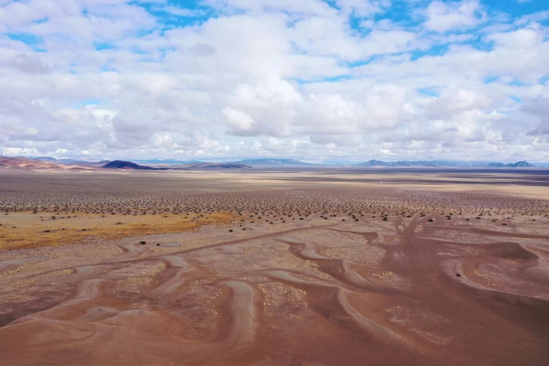 an aerial view of a wide open plain