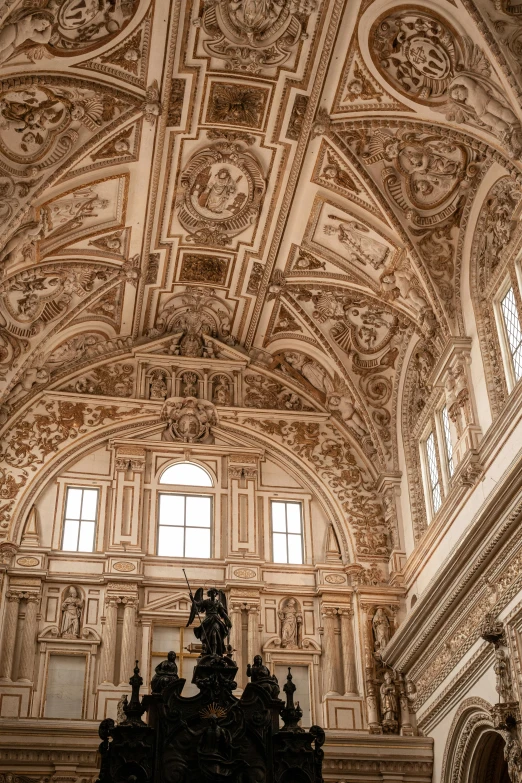 an ornate church ceiling with high ceilings