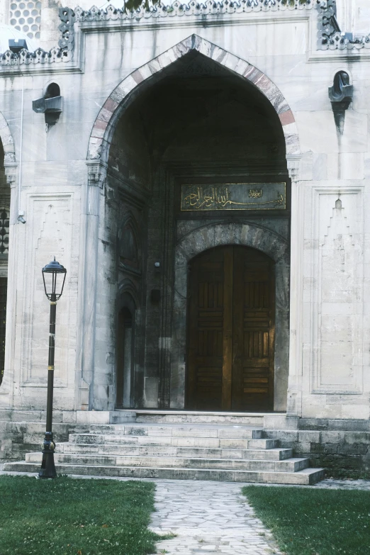 an arch in an old, stone building features an archway