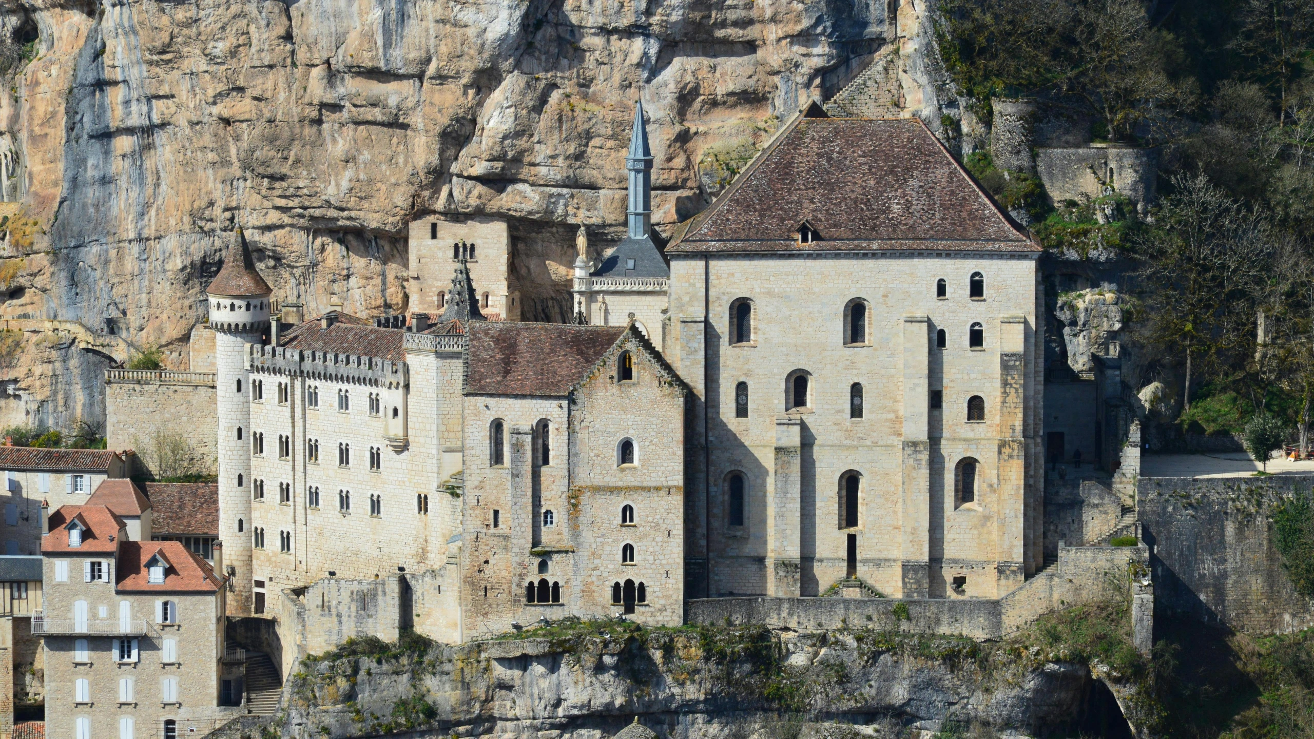 an old castle built into the side of a cliff