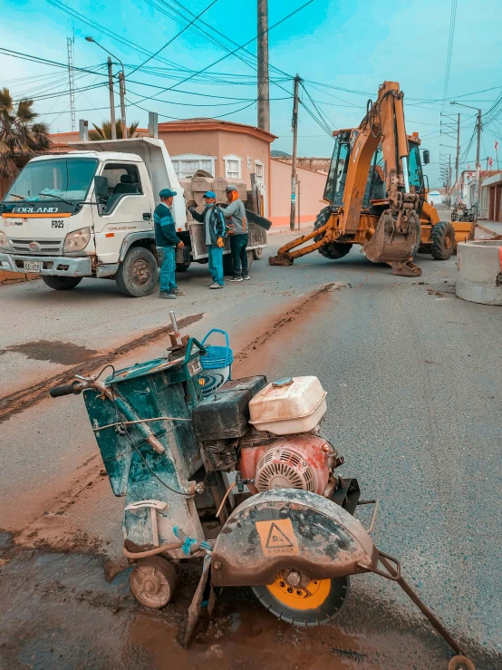 several construction workers at work on the road