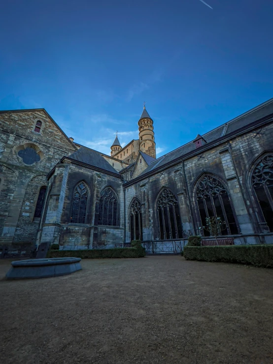 the view of an outside church at dusk