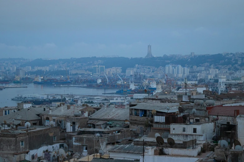 a view of the city and some hills in the distance