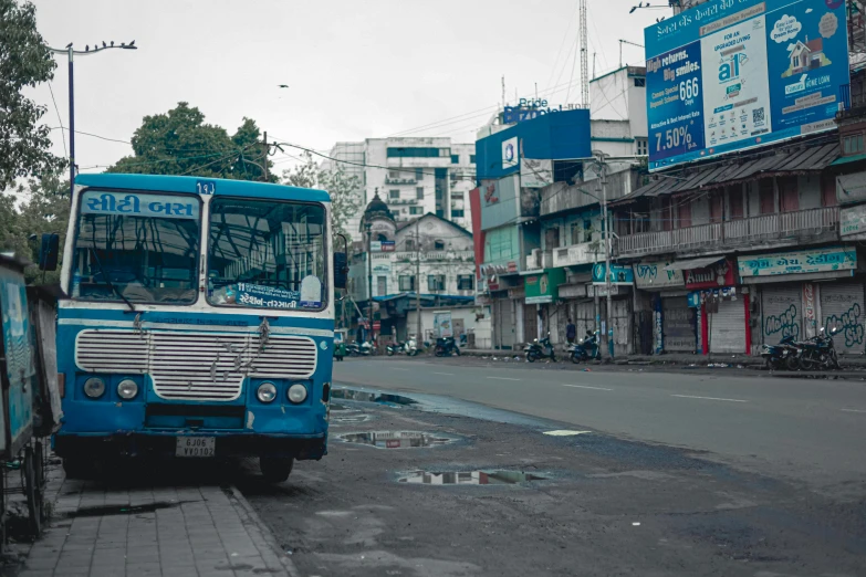 a bus is sitting by the side of the road