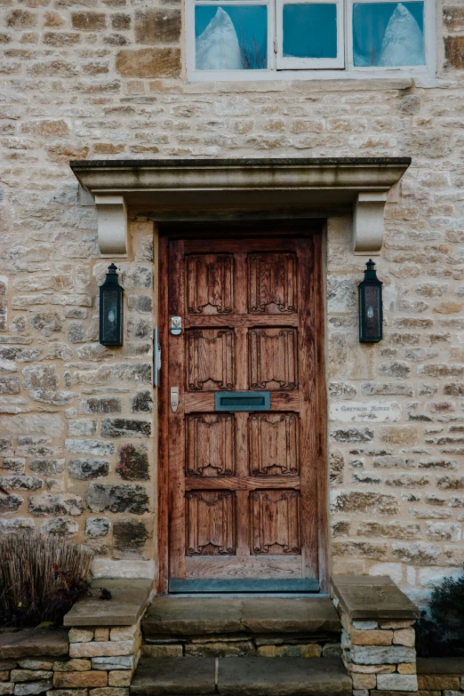 an old stone building with a wooden door