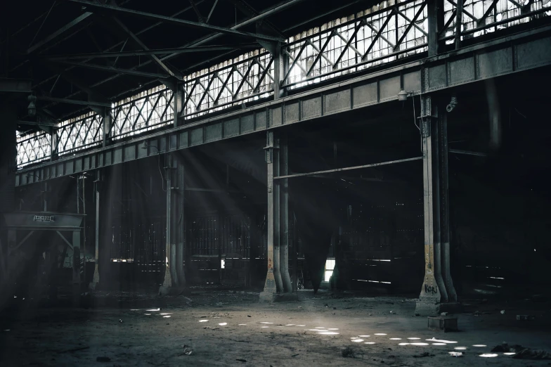 a large metal bridge suspended over a body of water