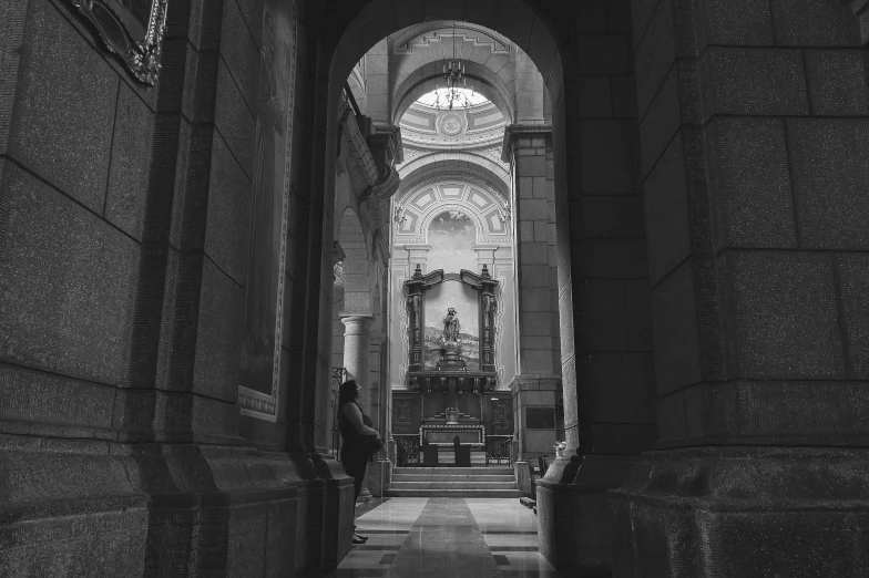 an archway in an old church with sculptures and walls