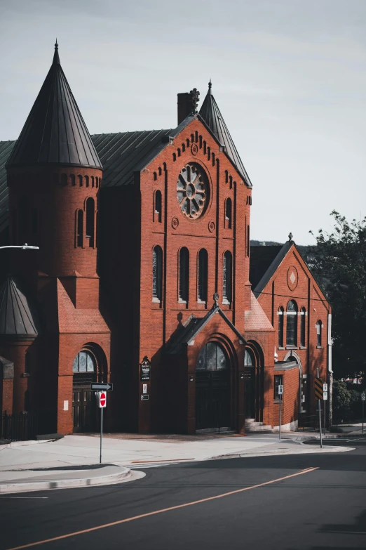 this is a big old red church with two clocks