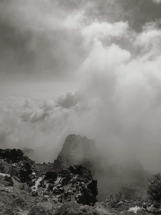 clouds moving over a mountain range on a cloudy day