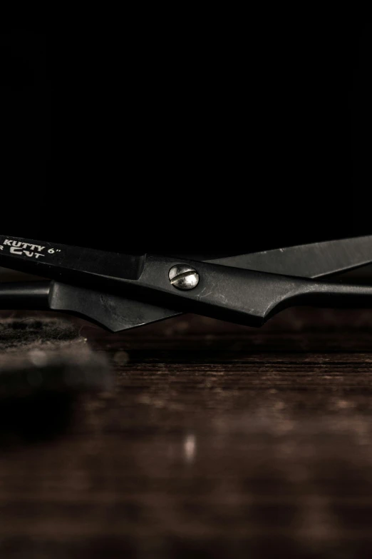 a close up of a pair of scissors sitting on a table