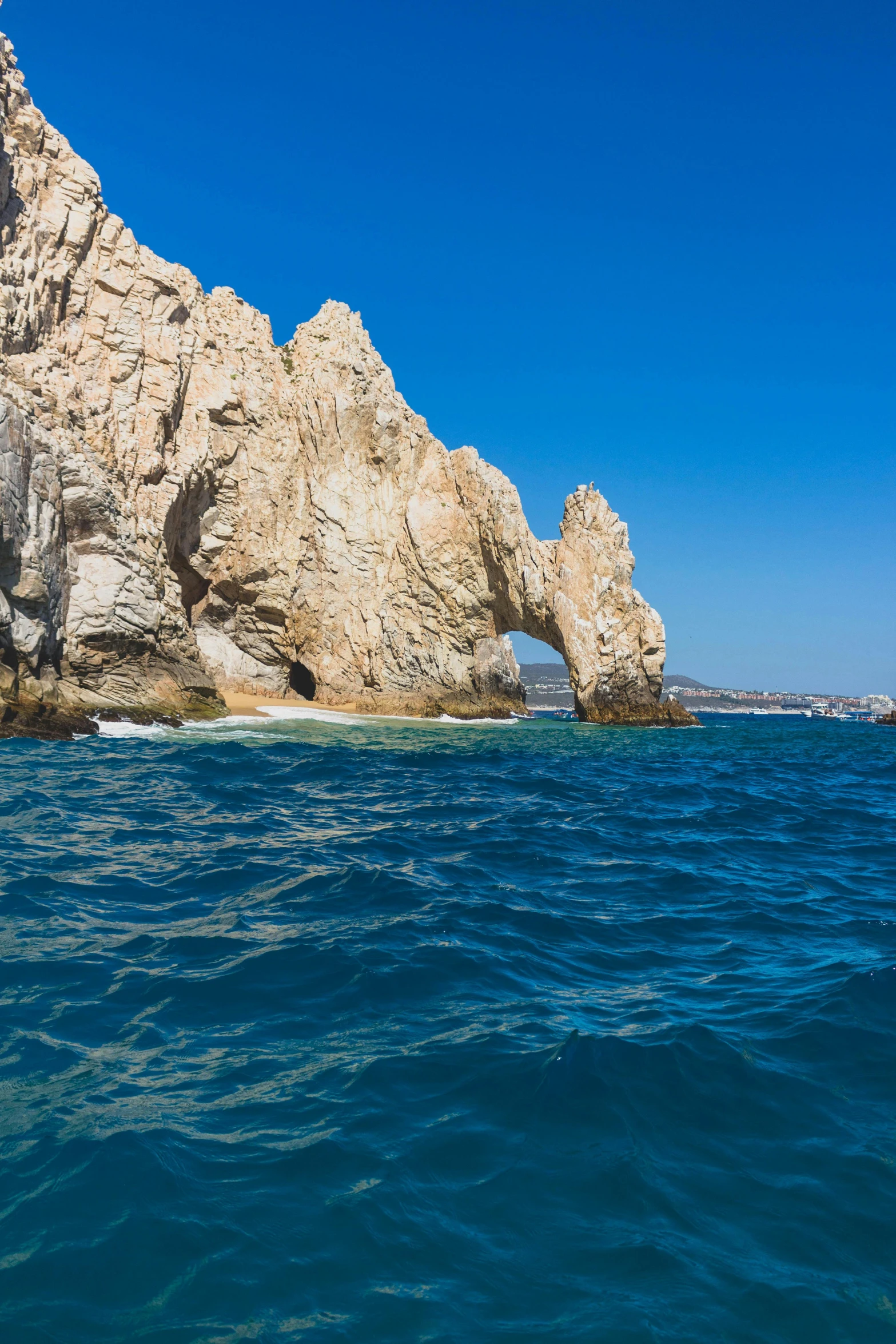 a very big rock out in the water