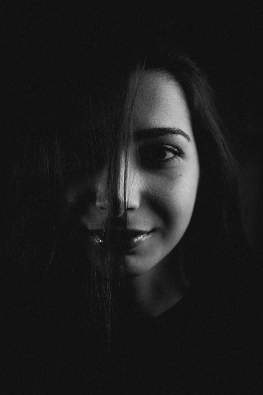 a woman smiles as she poses for a po