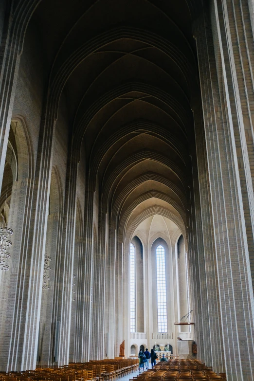 a church with rows of pews and walls