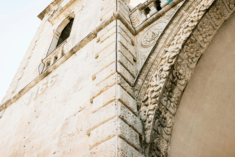 a close up of a very tall clock tower