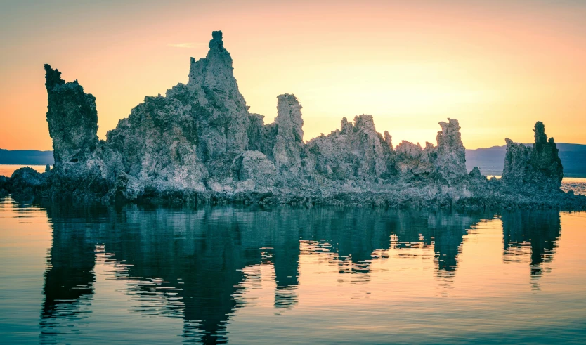 a body of water with rock formations on it