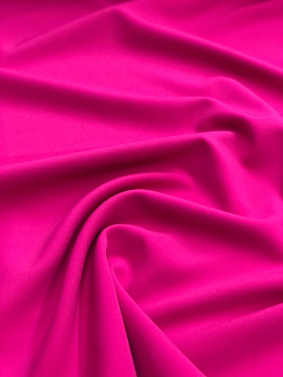 a pink satin fabric with some folds