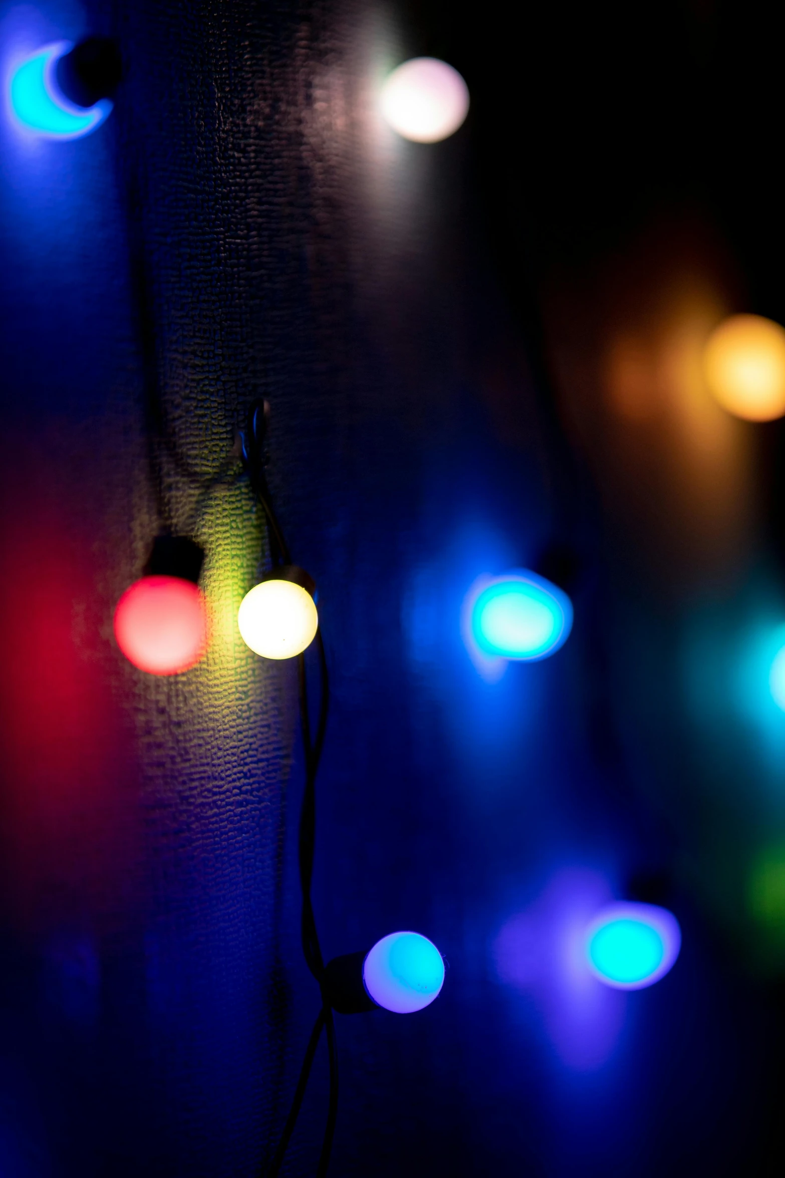 colorful lights reflected off the side of a wall