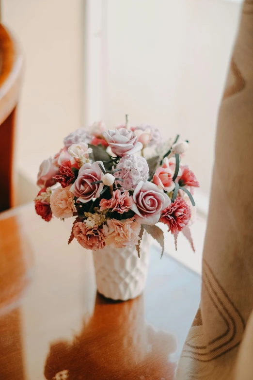 an image of flowers in the vase on table