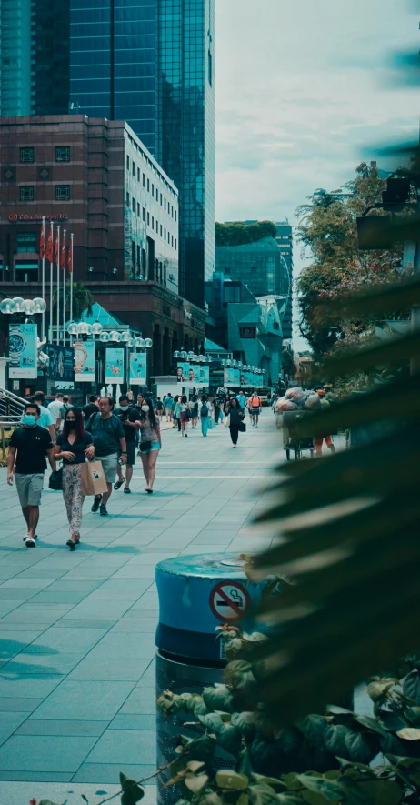 some people walking in a city near tall buildings