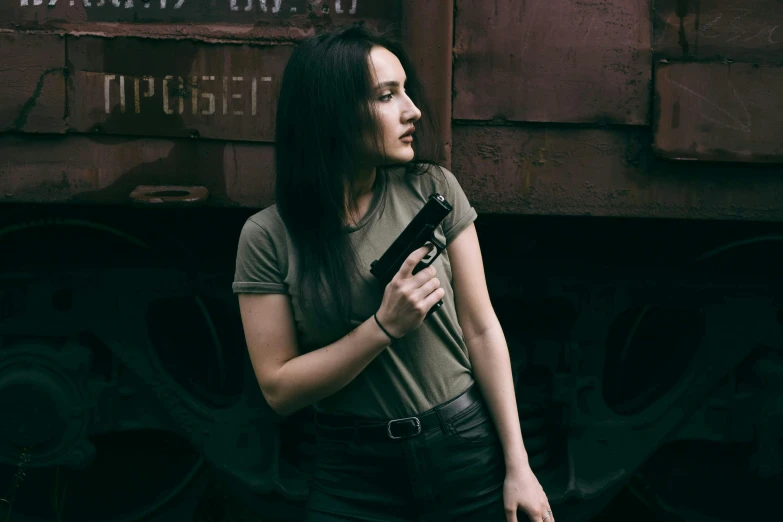 the girl is walking toward an old train