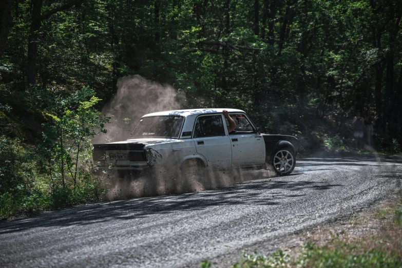 the pick - up truck is driving down the road