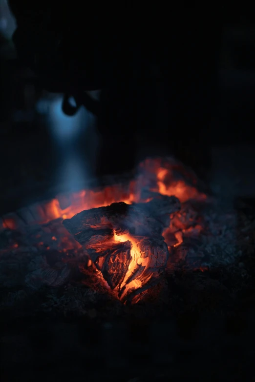 fire being lit on an open flame pit