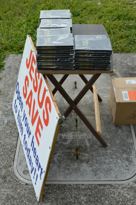 a table with a bunch of dvd's on it