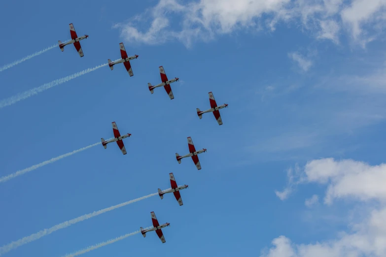 there are eight planes flying through the air