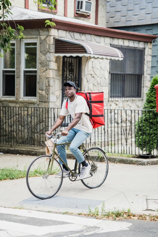 a man riding a bike down a city street