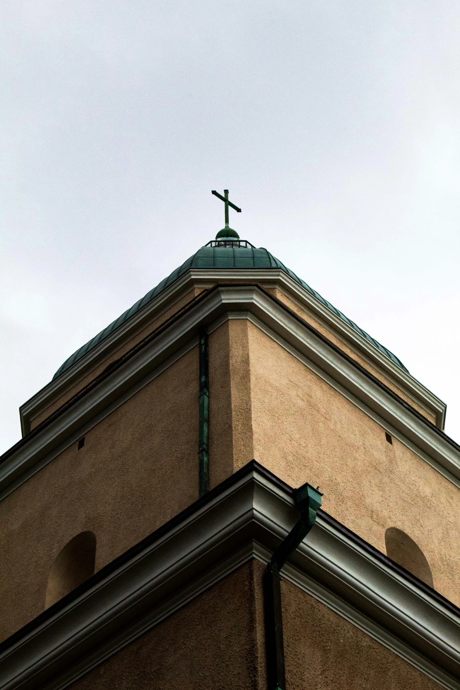 the cross is on the top of a building