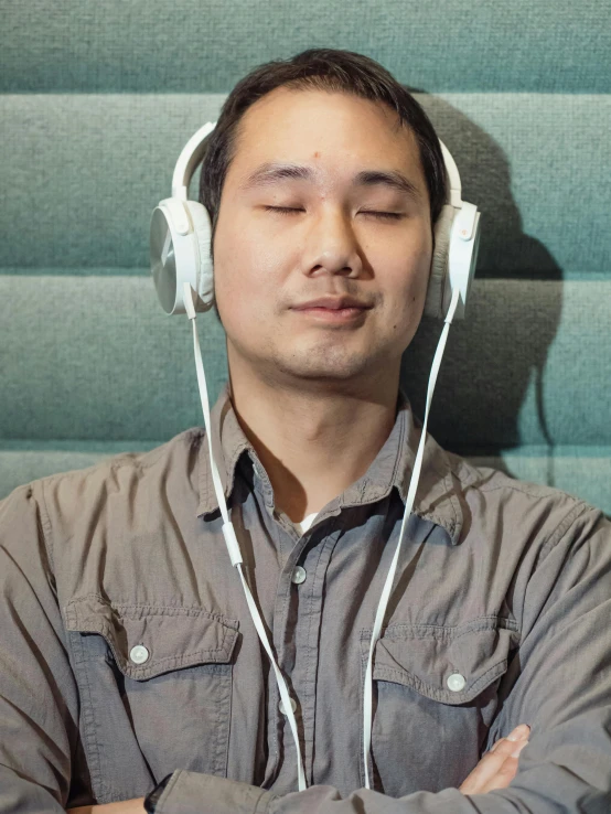 the man is wearing headphones and listening to music