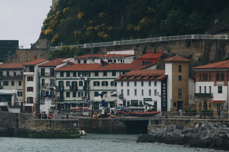 a group of buildings sitting on the side of a river