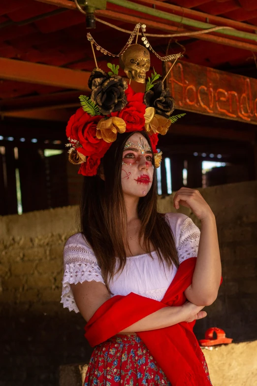 woman with makeup on head with flowers in hair and dress