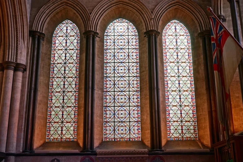 the interior of a building with three windows and a wooden table