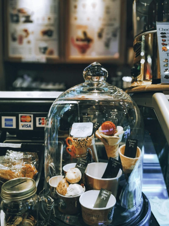 a small ice cream shop display full of different flavors