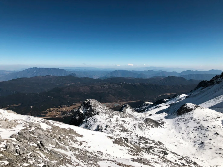 a mountain range with lots of snow on it