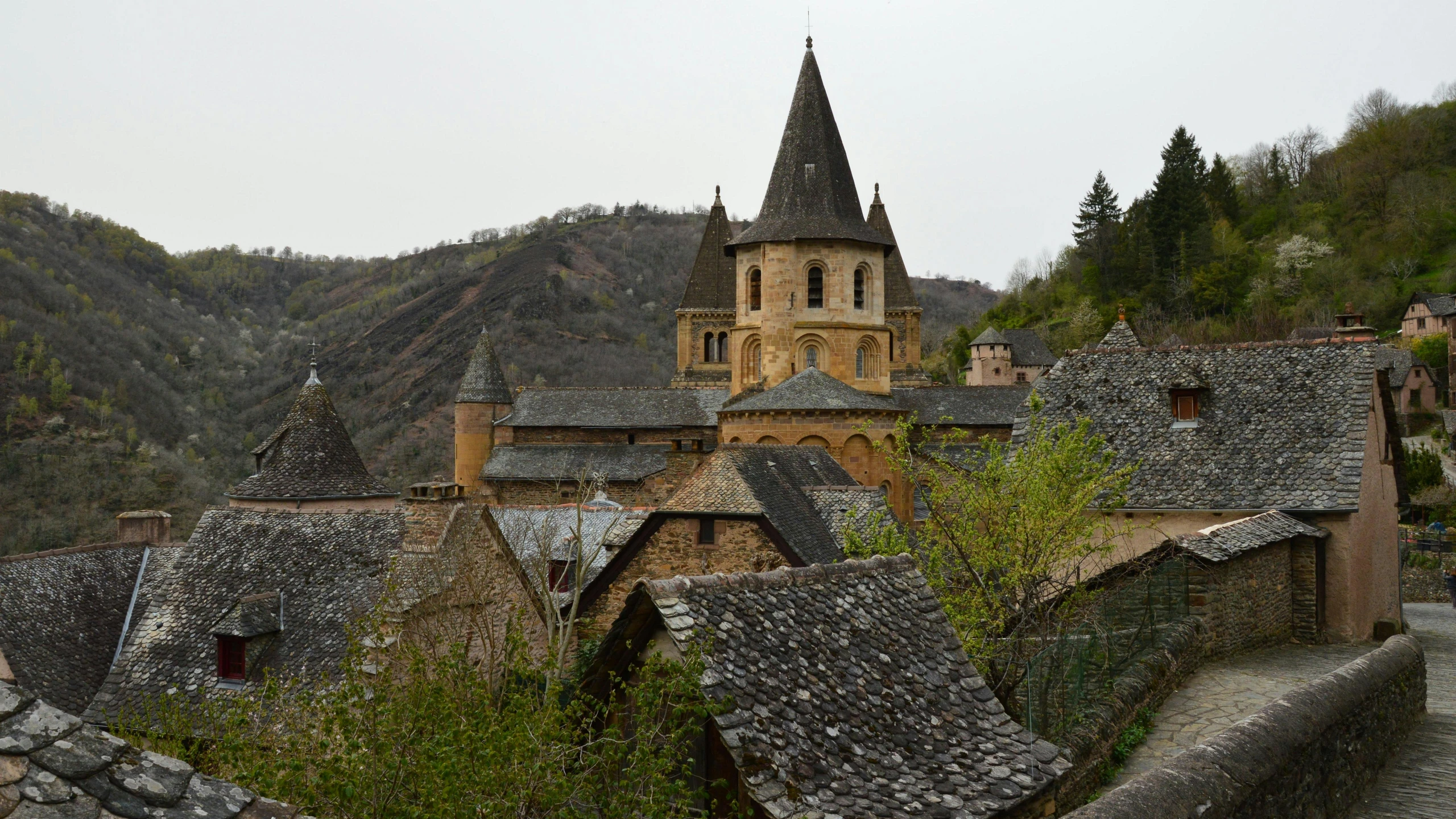 a village in the mountains with roofs that look like buildings