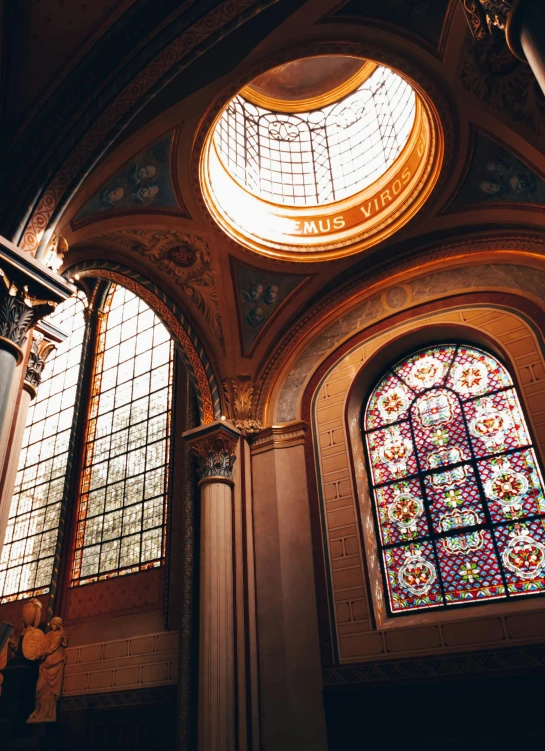 a dome window in a large room with other windows