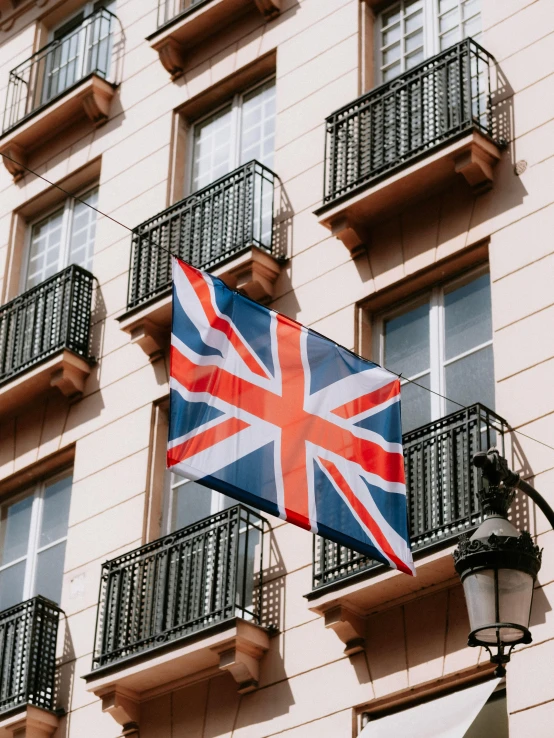 a flag hanging on the side of a building