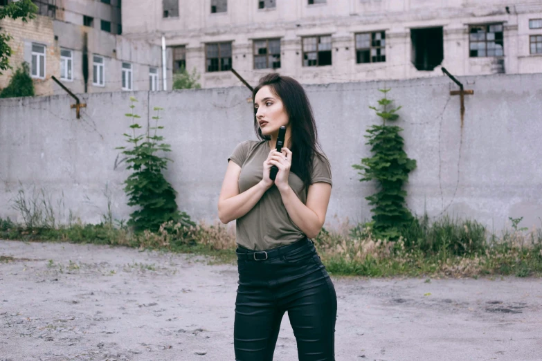 a person in a green shirt and black pants