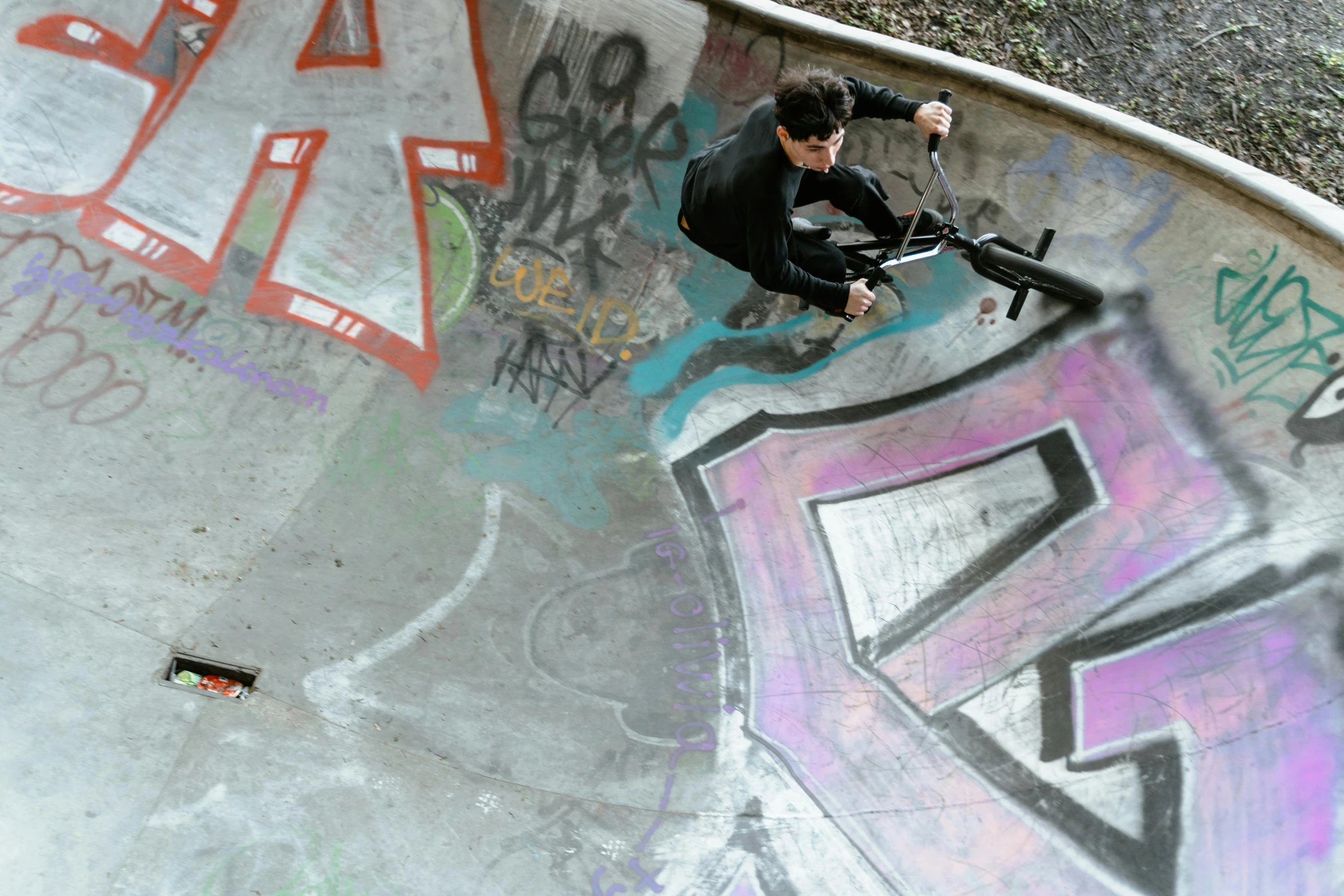 a man riding a skateboard up the side of a ramp