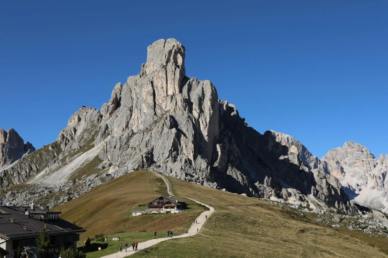 a building sits on the top of a mountain