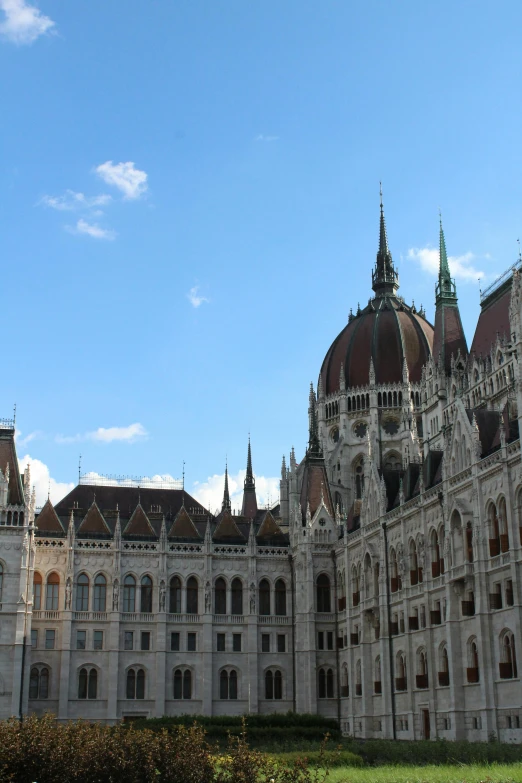 an ornate building with two green domes and windows