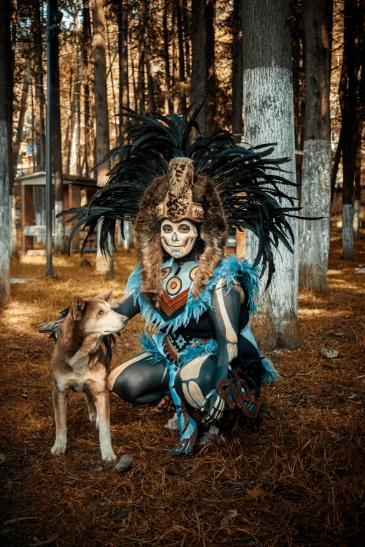 a person in a costume next to a dog