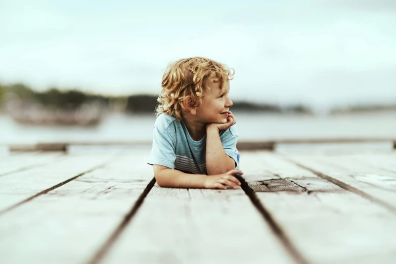 a small  that is laying down on a deck