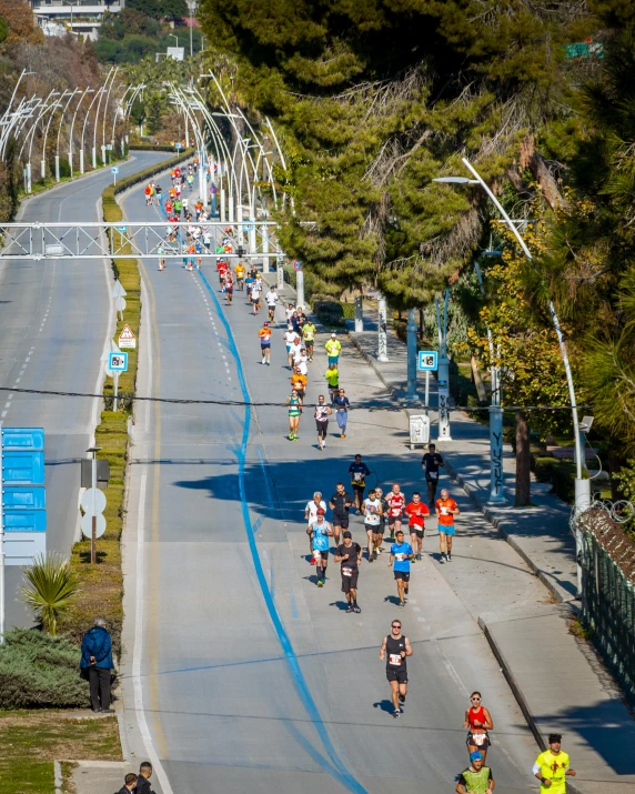 people running down a road during the marathon