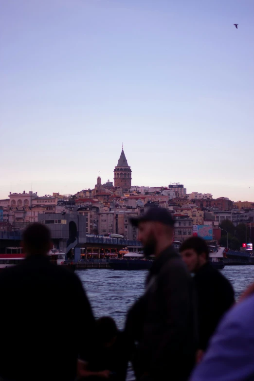 a man watches soing as the sun sets